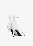 DECOLLETE PUMPS IN PATENT LEATHER WHILE